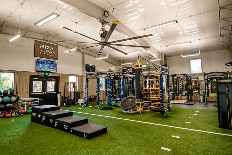 Functional turf and squat racks at the Montana Athletic Club